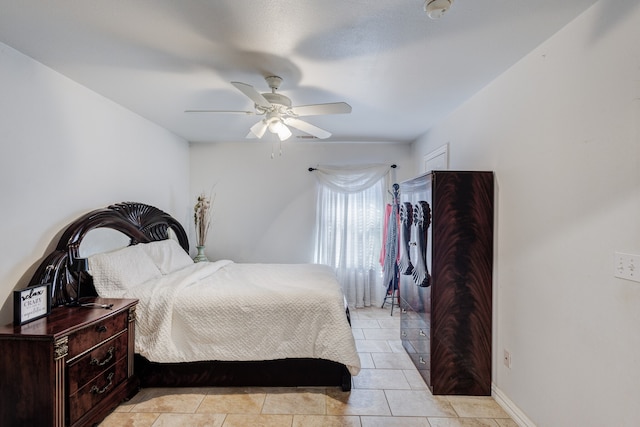 tiled bedroom with ceiling fan