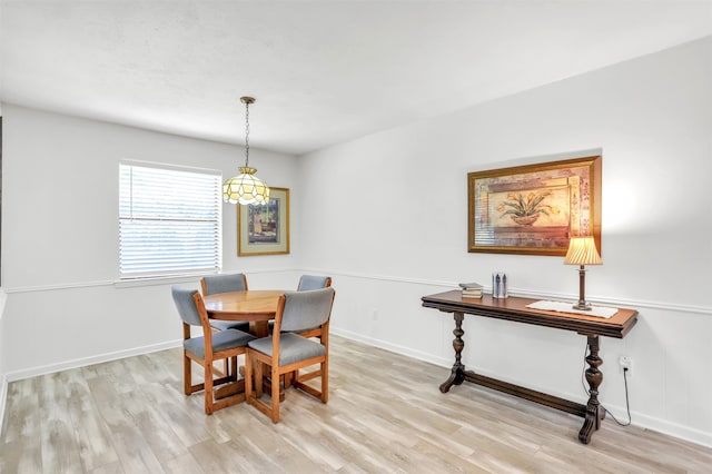 dining area with light hardwood / wood-style flooring