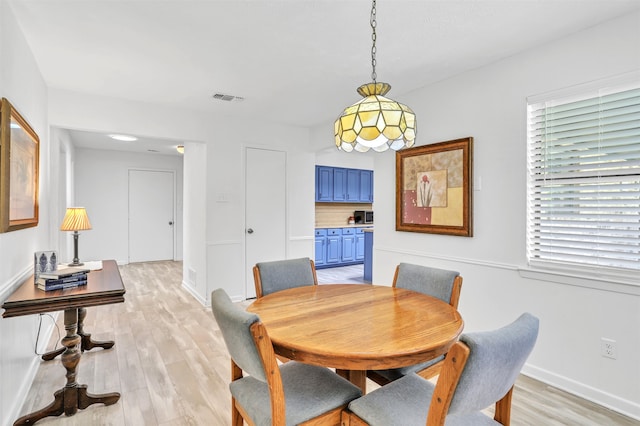 dining space featuring light hardwood / wood-style floors