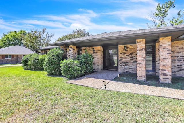 property entrance with a yard