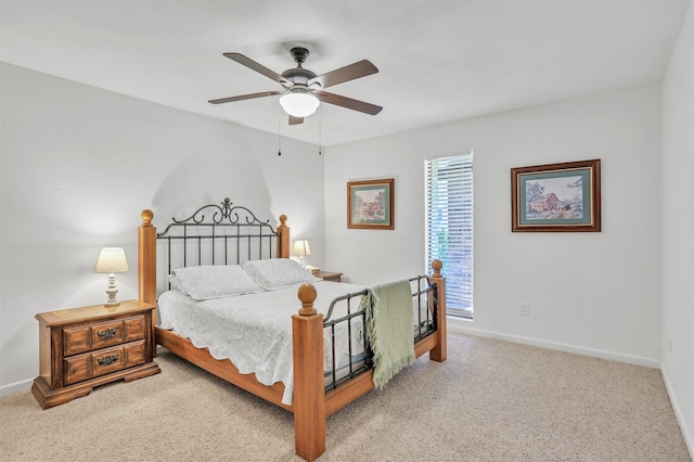 bedroom featuring light colored carpet and ceiling fan