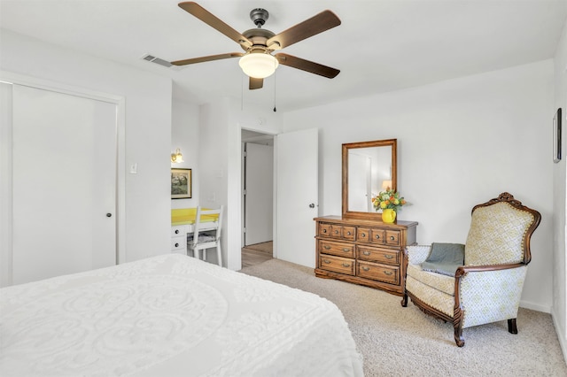 bedroom featuring light carpet and ceiling fan