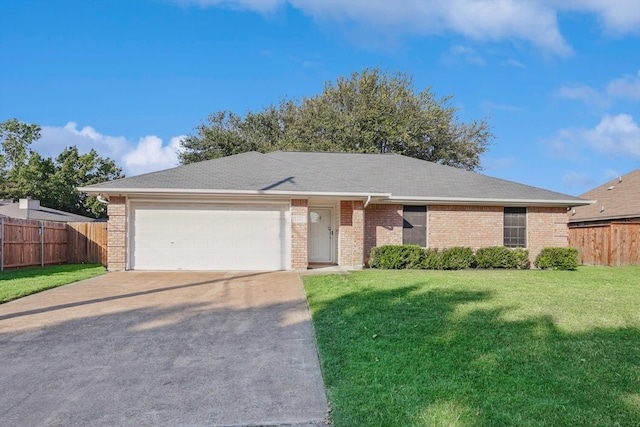 ranch-style home with a garage and a front lawn