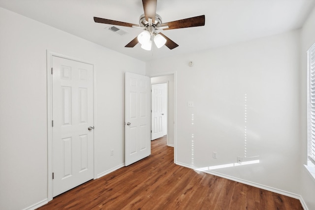 unfurnished bedroom with wood-type flooring and ceiling fan