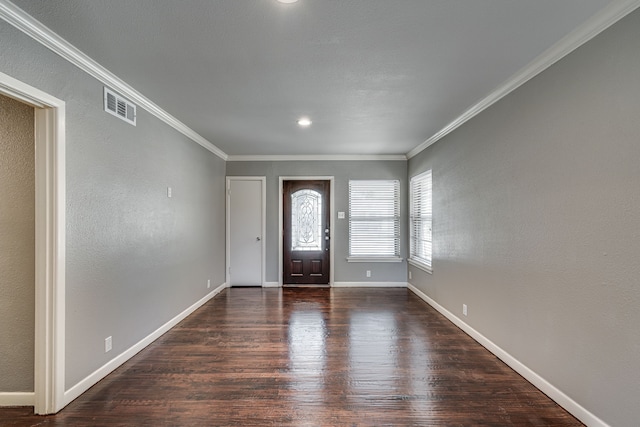 entryway featuring ornamental molding and dark hardwood / wood-style flooring