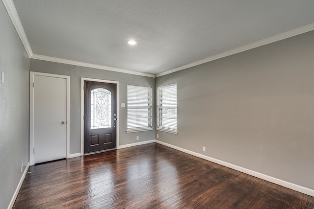 entrance foyer featuring crown molding and dark hardwood / wood-style floors