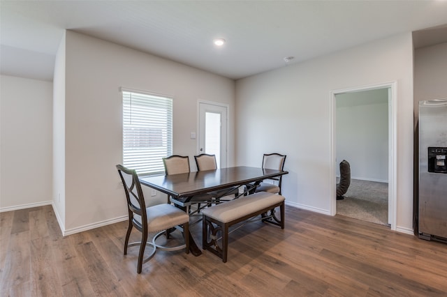 dining space featuring wood-type flooring