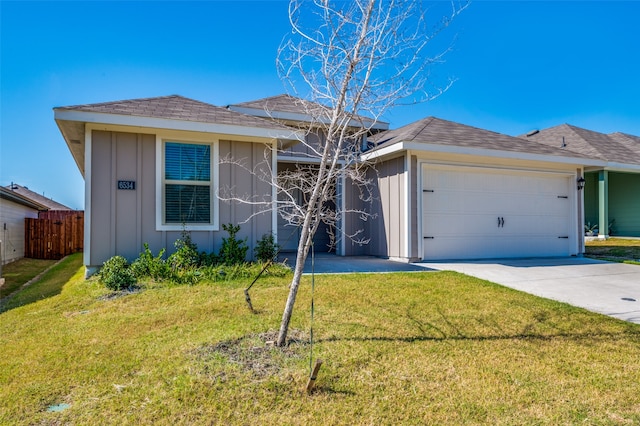 ranch-style house with a front yard and a garage