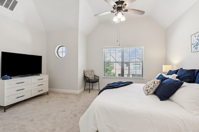 bedroom with ceiling fan, light carpet, and vaulted ceiling