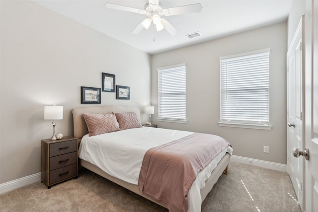 bedroom featuring ceiling fan and light carpet