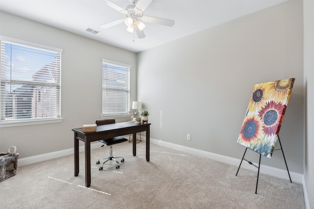 home office with light carpet and plenty of natural light