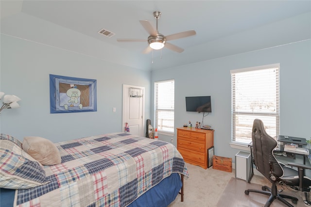 bedroom featuring light colored carpet and ceiling fan