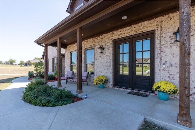 view of exterior entry featuring french doors