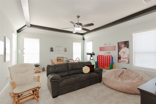 carpeted living room featuring ceiling fan