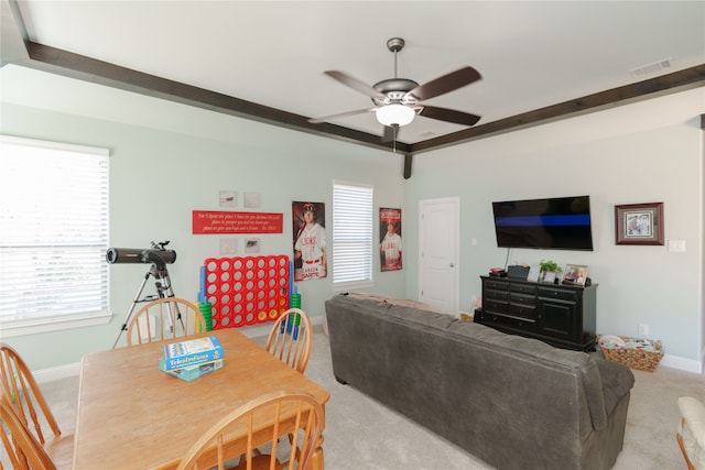 carpeted living room featuring ceiling fan