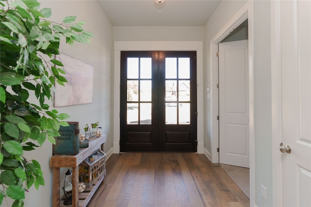 doorway to outside with french doors and dark hardwood / wood-style floors