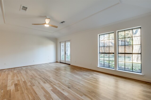 spare room featuring ceiling fan, french doors, crown molding, and light hardwood / wood-style flooring