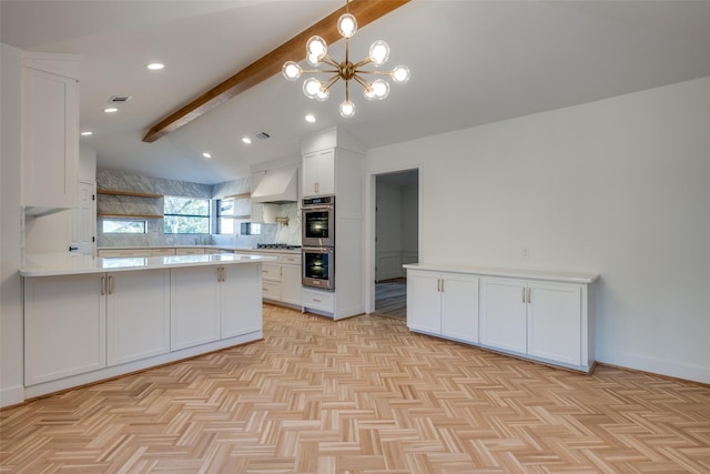 kitchen featuring white cabinetry, stainless steel appliances, an inviting chandelier, kitchen peninsula, and custom exhaust hood