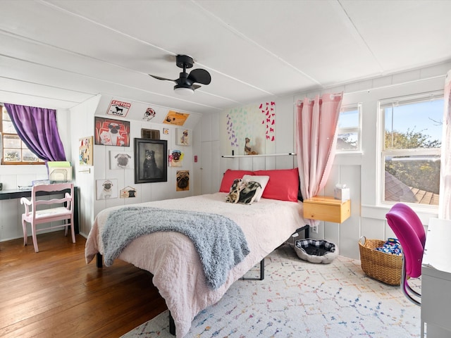 bedroom with wood-type flooring and ceiling fan