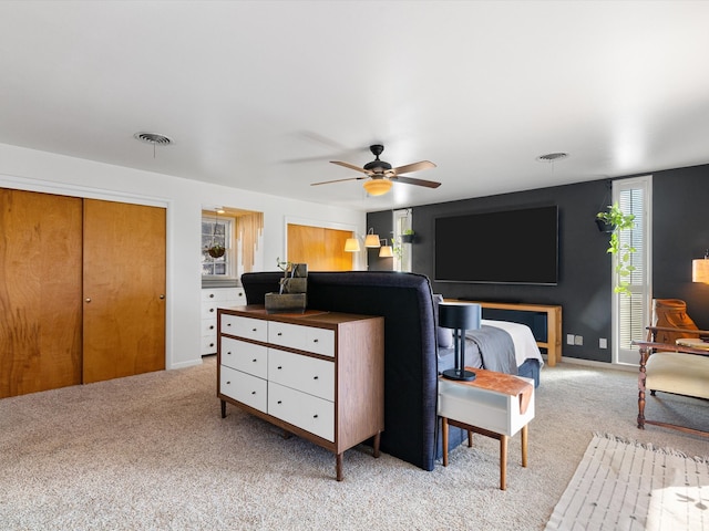 carpeted bedroom featuring ceiling fan