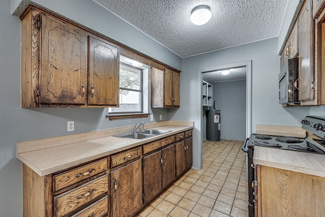 216 W Marshall St, Palmer, TX 75152 - kitchen with a textured ceiling, a sink, light countertops, black appliances, and electric water heater