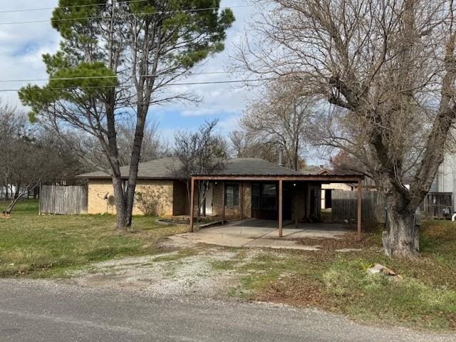 view of front of property with a carport