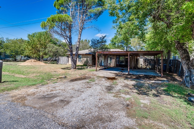 exterior space featuring a carport