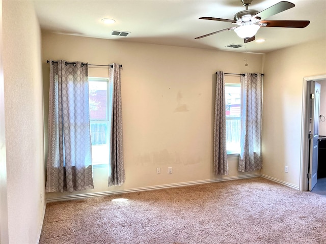 empty room with carpet floors and ceiling fan