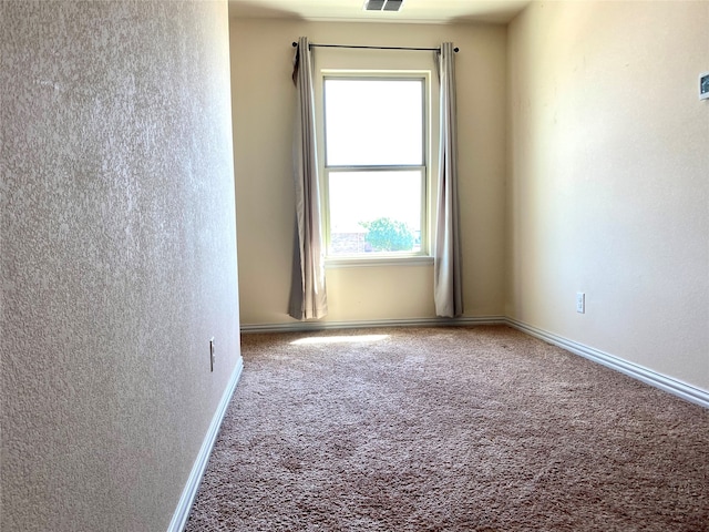 view of carpeted spare room