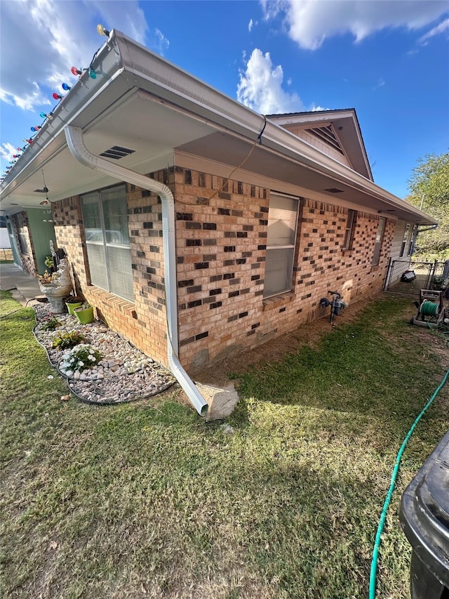 view of home's exterior featuring a yard