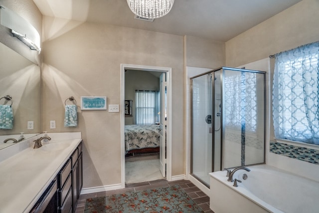 bathroom with vanity and independent shower and bath