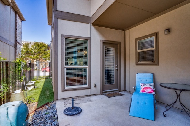 doorway to property with a patio