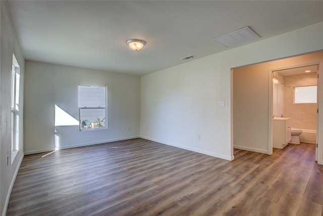 spare room with dark hardwood / wood-style flooring