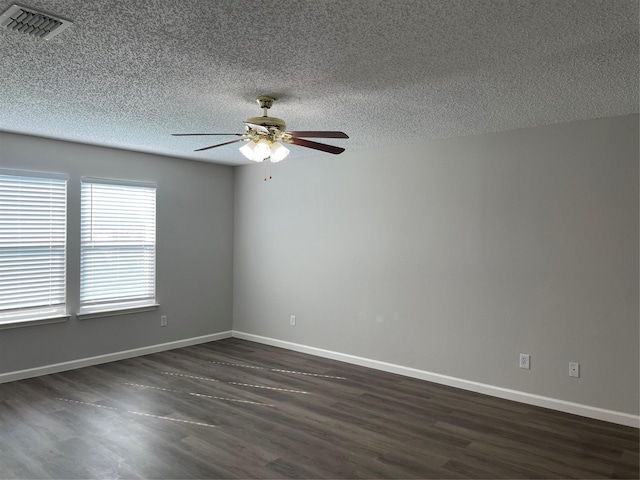 unfurnished room with dark wood-type flooring, ceiling fan, and a textured ceiling