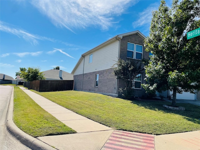 view of side of property with a lawn