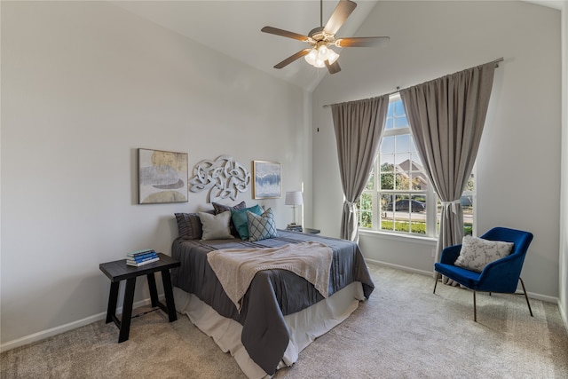 carpeted bedroom with vaulted ceiling and ceiling fan