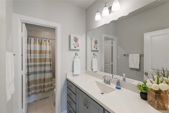 bathroom featuring toilet, vanity, and tile patterned floors