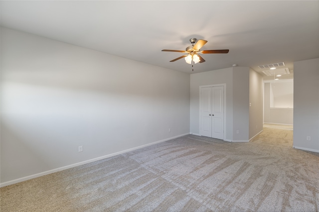 empty room with light carpet and ceiling fan