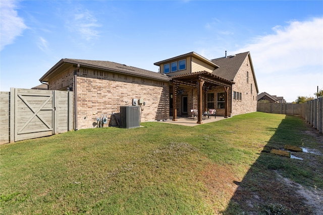 rear view of house with a patio, cooling unit, a lawn, and a pergola