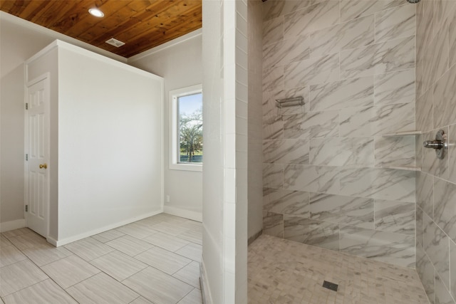 bathroom with tiled shower and wooden ceiling