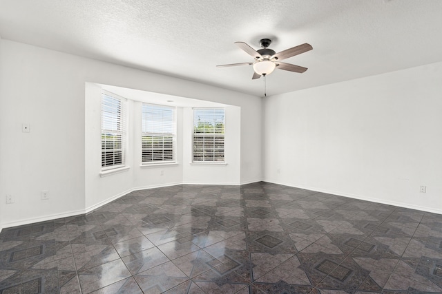 spare room with ceiling fan