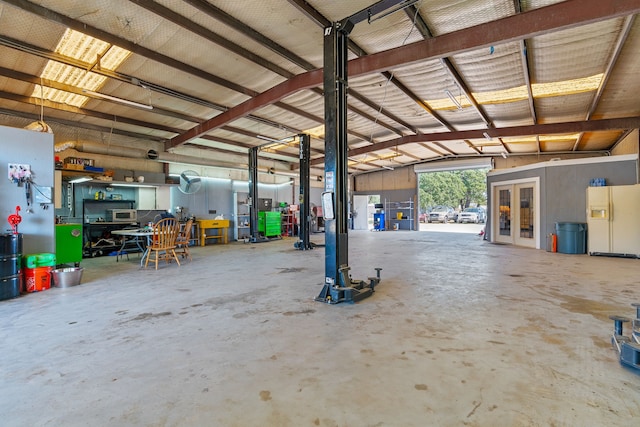 garage with white refrigerator with ice dispenser