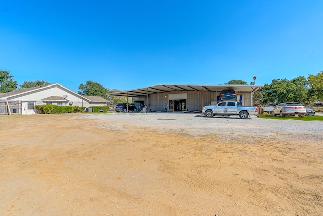 exterior space with a carport