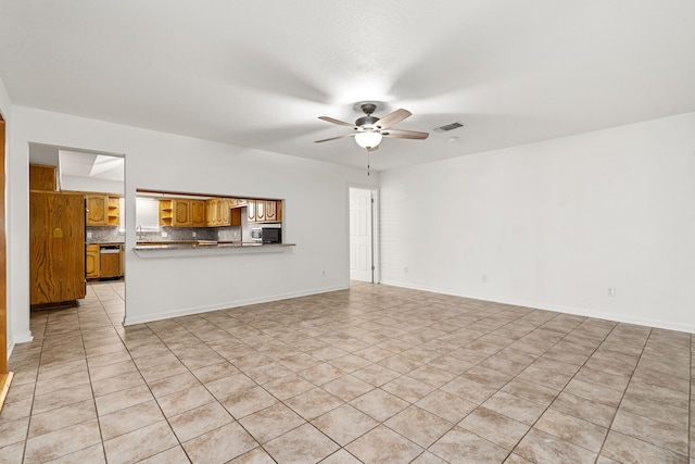 unfurnished living room featuring ceiling fan and light tile patterned floors