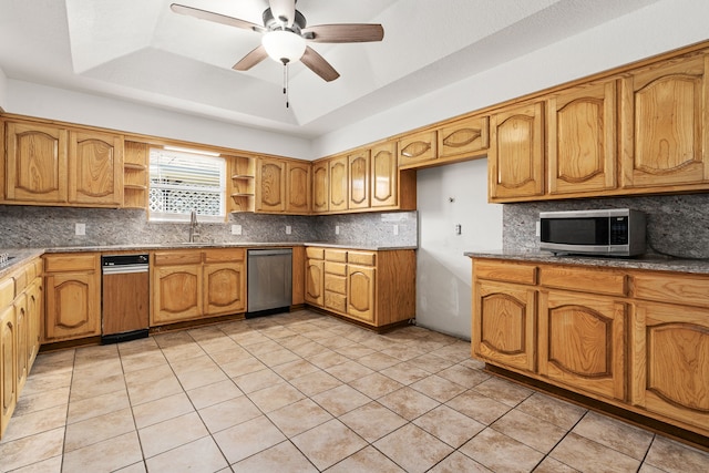 kitchen with backsplash, black appliances, ceiling fan, light tile patterned floors, and a tray ceiling