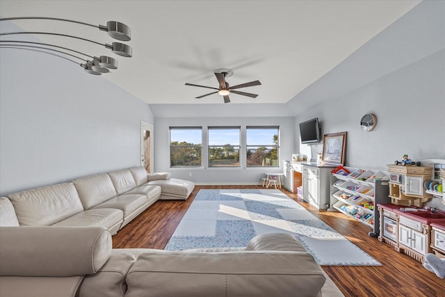 living room with vaulted ceiling, ceiling fan, and dark hardwood / wood-style flooring