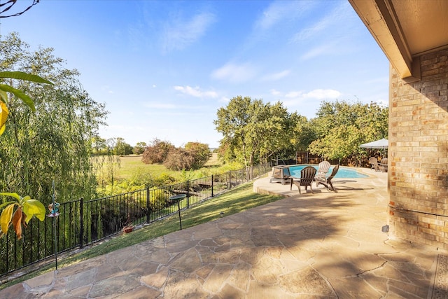 view of patio / terrace featuring a fenced in pool