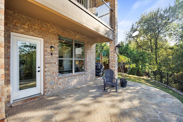 view of patio with a balcony