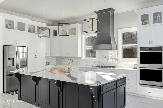 kitchen featuring stainless steel appliances, light stone countertops, decorative light fixtures, and premium range hood