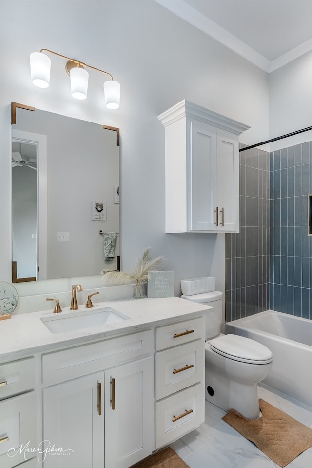 full bathroom with vanity, tiled shower / bath, and toilet